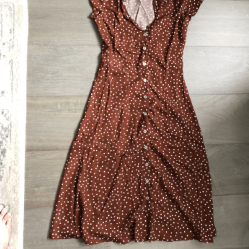Grill trim polka dot red dress.
